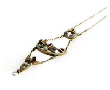 A gem-set and enamelled pendant, early 20th centuryOf open, stylised geometric design, channel set with calibré-cut rubies, a