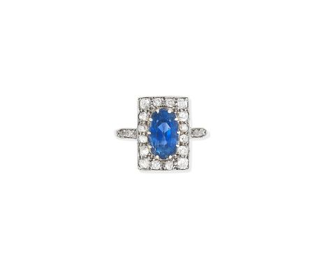 A Sapphire and diamond plaque ring, early 20th centuryClaw-set with an oval cut sapphire, measuring approximately 10.8 x 6.5 