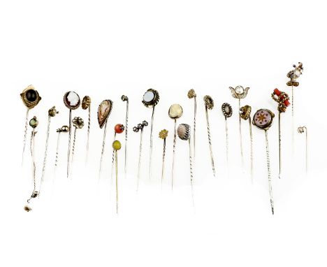 A collection of mostly gem-set stickpinsComprising: one with enamelled terminal, modelled as a knight's helmet, with dragon c