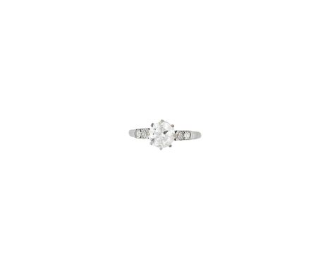 A diamond single-stone ringClaw-set with a round brilliant-cut diamond, measuring approximately 1.00ct, the shoulders set wit