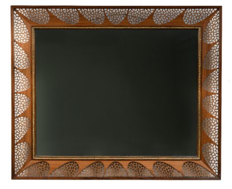 Stuart Devlin, (Australian, born 1931), an Indian rosewood filigree wall mirror, circa 1980, the rectangular plate with carve
