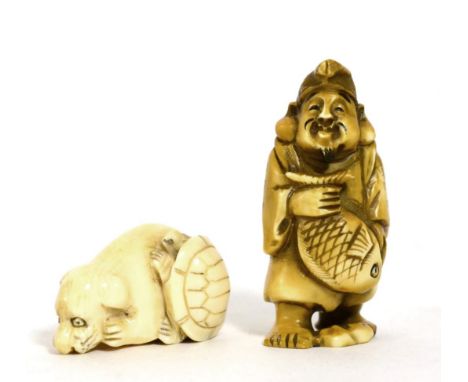 An early 20th century carved ivory netsuke in the form of a dog and turtle together with a stained bone netsuke 