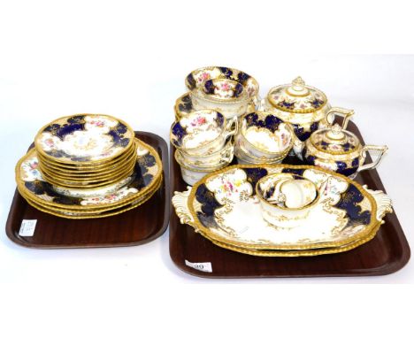 A Coalport tea service in the 'Batwing' pattern, including two teapots, oval plates etc 
