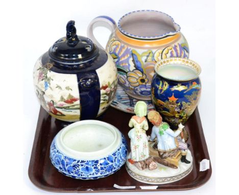 A group of ceramics comprising an early Poole pottery jug, a Dresden group depicting Winter, Carlton ware vase, Chinese plate