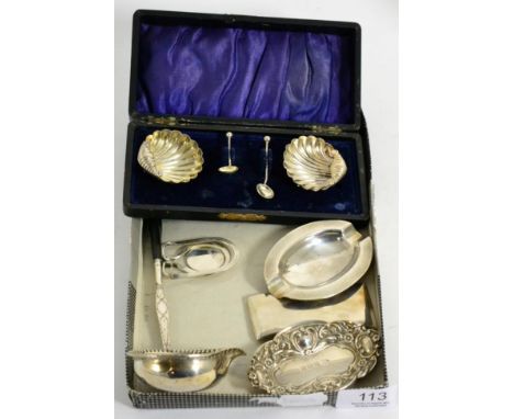 A silver toddy ladle, a pair of salts, a dish, an ashtray, a card case and a coin holder 