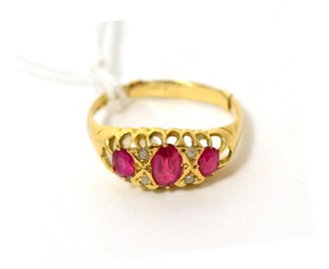 An 18ct gold ruby and diamond ring Finger size R1/2, 2.61g gross.