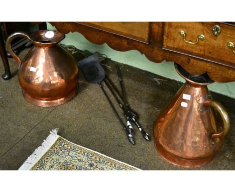 Two 19th century copper harvest jugs together with a set of three iron fire tools 