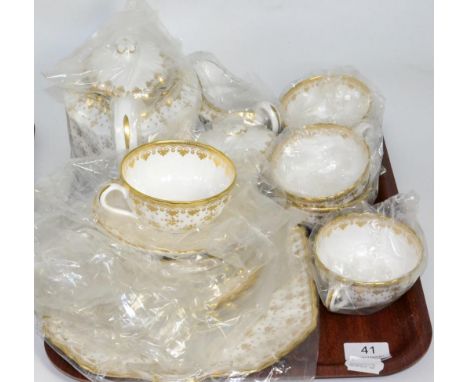 A Spode Fleur de Lys pattern tea service, including teapot, unused and still in wrappers 