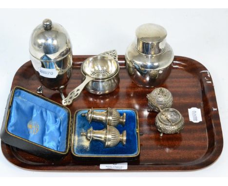 A group of silver comprising pair of cased peppers, tea strainer and stand, caddy, Indian pepper and salt and an Elkington pl