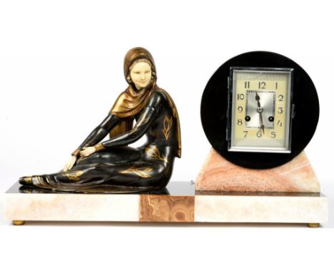 A FRENCH ART DECO BRONZED METAL, MARBLE AND ALABASTER MANTEL CLOCK, THE RECTANGULAR BASE WITH THE FIGURE OF A SEATED YOUNG WO