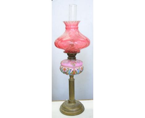 A VICTORIAN BRASS OIL LAMP WITH MOULDED AND BLANCMANGE PINK SHADED AND ENAMELLED GLASS FOUNT, DECORATED WITH STYLISED FLOWERS