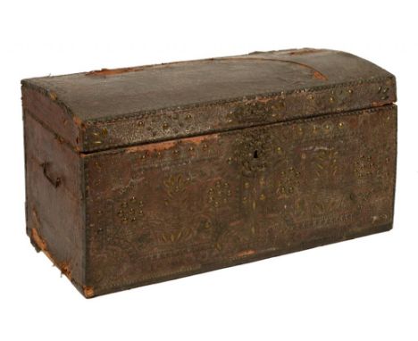 A NORTHERN EUROPEAN EMBOSSED BRASS AND NAILED LEATHER COVERED TRAVELLING TRUNK, EARLY 19TH C, with iron lock and carrying han