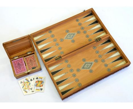 AN INDIAN CARVED SANDALWOOD, IVORY AND SADELI FOLDING GAMES BOARD, 45CM L, 19TH C AND AN OLIVE WOOD PLAYING CARD BOX