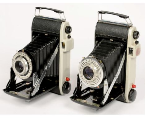 A KODAK STERLING II FOLDING CAMERA, LEATHER CASE AND A KODAK JUNIOR II FOLDING CAMERA, PLASTIC CASE 