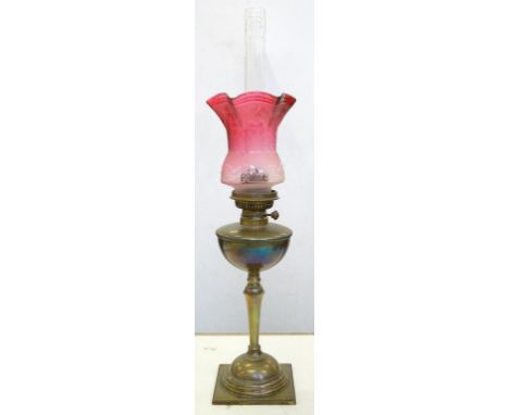 AN EDWARD VII CAST BRASS OIL LAMP OF UNUSUALLY SMALL PROPORTIONS WITH HEMISPHERICAL FOUNT AND BURNER, CONTEMPORARY PINK SHADE
