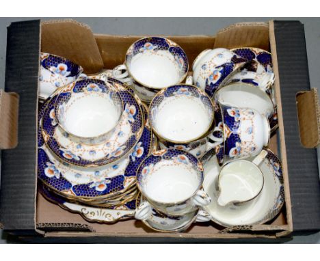 A WARWCK B&amp;S CHINA TEA SERVICE, INCLUDING 12 CUPS, 12 SAUCERS, 11 PLATES, 2 CAKE PLATES, SLOPS BOWL AND MILK
