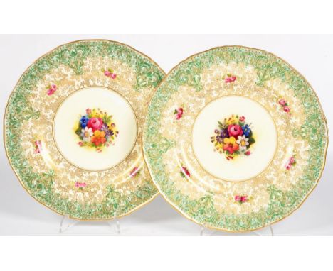 A PAIR OF ROYAL WORCESTER PLATES, PRINTED AND PAINTED WITH FLOWERS, SIGNED HUNT, IN GREEN AND GILT BORDER WITH PAIRS OF ROSES