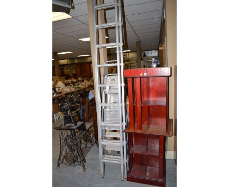 An aluminium extending ladder; and three aluminium step ladders.