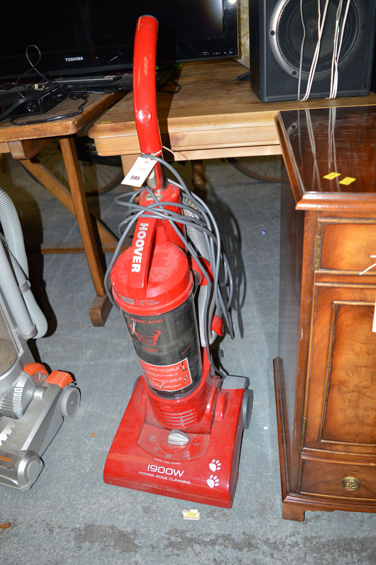 A modern Hoover 1900 watt vacuum cleaner with onboard attachments.