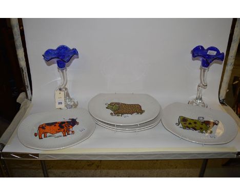 A pair of handmade Studio Glass vases, with flared blue tops, clear glass shaped stems and circular bases, by Sabina; and a s