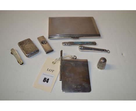 A silver cigarette case with Art Deco design and engine turned decoration; a silver cigar cutter also with engine turned deco