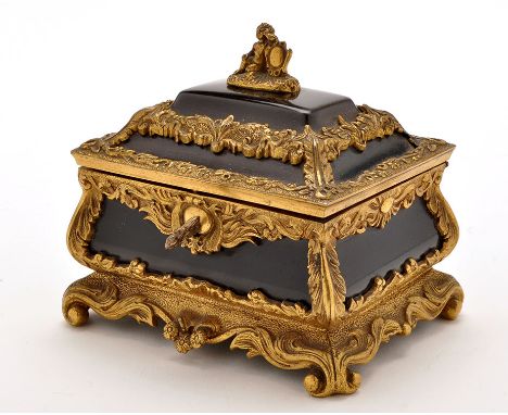 A 19th Century French ebony jewellery casket, decorated overall with ormolu foliate mounts, the caddy top mounted with cherub