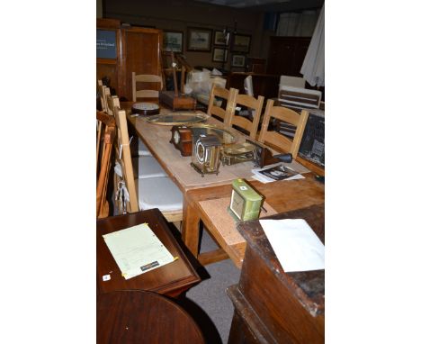 A modern heavily built oak draw leaf dining table, raised on substantial square legs joined by stretchers; together with a se