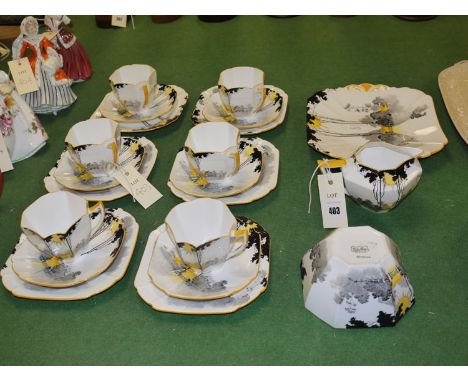 A Shelley early 20th Century twenty-one piece tea set in 'Sunrise and Tall Trees' pattern, comprising: six cups, saucers and 