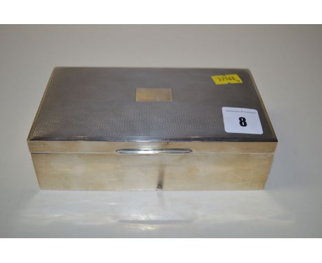 A silver mounted cigarette box, by H. Bros., Birmingham 1956, with engine turned decoration.