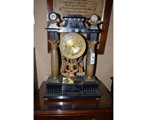 An Austrian portico mantel clock, with silvered Arabic chapter ring and gilt matted centre, signed In Wien, three-train chimi