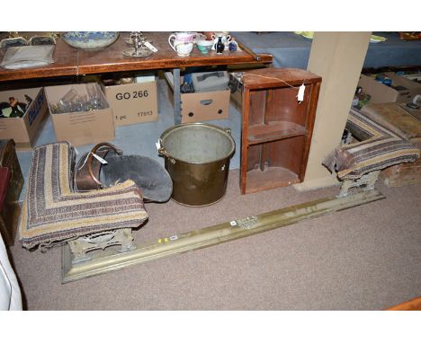 An early/mid 20th Century brass club fender, the L-shaped seats upholstered in tapestry pattern material and in need of re-up