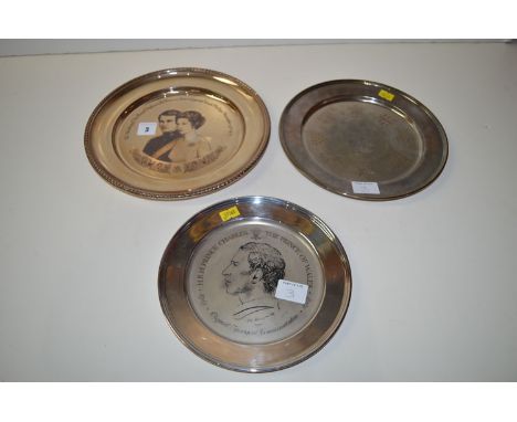 Three silver commemorative plates, one for the wedding of Princess Anne to Capt. Mark Phillips 1973; one for Prince Charles, 