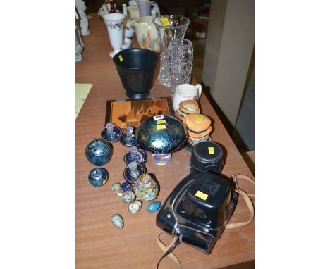 A collection of Studio Glass paperweights in the form of mushrooms, apple etc; a Pentacon camera and a lens; and miscellaneou