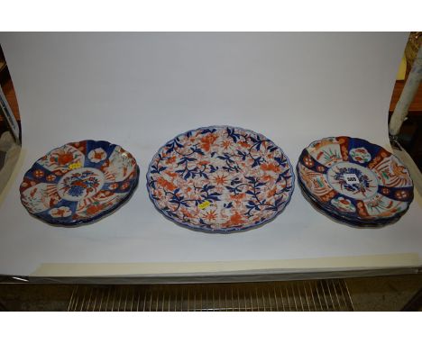 A set of five Imari circular plates; and a similar larger plate.