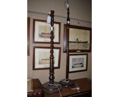 An oak spiral twist standard lamp; and a stained wood standard lamp.