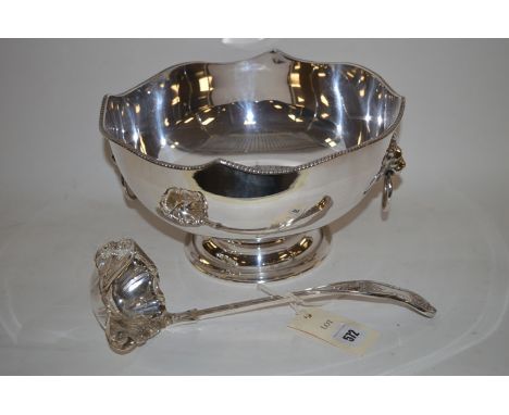 An EPNS punch bowl with two lion mask handles; and a ladle.