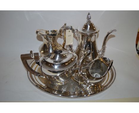 A four-piece oval EPNS tea service; an EPNS jug; and an oval tray.