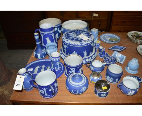 A collection of blue Jasper ware, including: a large cheese plate and cover (damaged); two large bowls; jugs; plate; trinket 