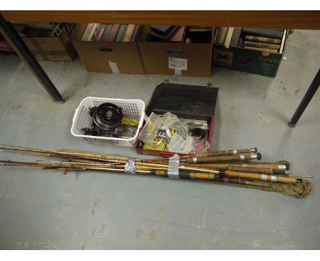 A quantity of mainly split cane fishing rods; a quantity of reels; lures; and tackle.