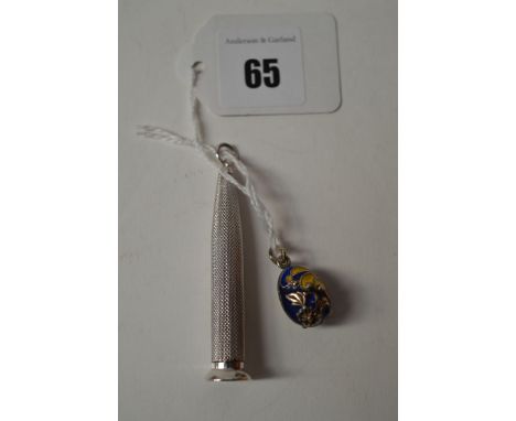 A silver cigar pricker by E. B. Birmingham 1951, of torpedo shape with engine turned decoration; together with an enamelled s