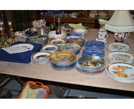 A large collection of miscellaneous Collectors' plates, including The Royal Horticultural Society Signature Edition, decorate