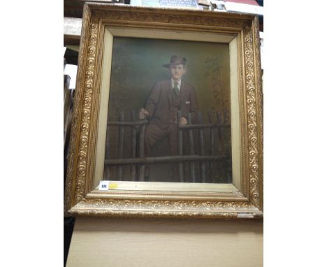A hand-painted photographic portrait of an Edwardian gentleman, in ornate gilt frame.