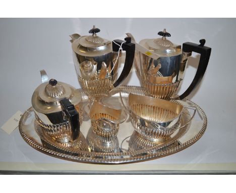 A five-piece oval half-fluted EPNS tea service by M & C; and a near matching oval tray.