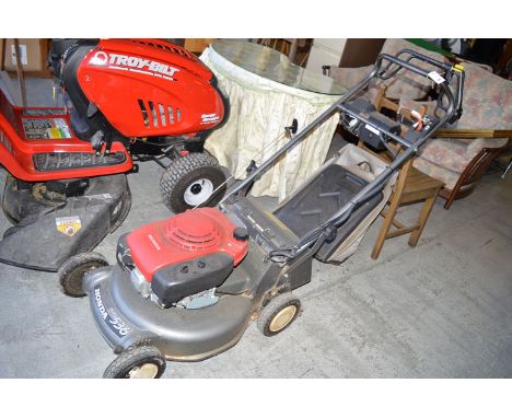 A Honda Hydrostatic HRD536 petrol driven self propelled rotary lawn mower with electric starter (probably needs new battery).