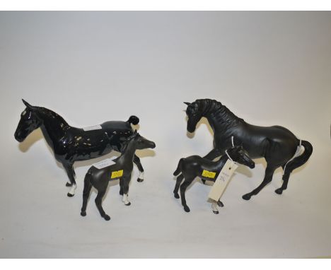 Four Beswick horses, to include: Champion 'Black Magic'; together with three matt, a Stallion and two foals.
