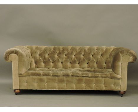 A green buttoned Chesterfield settee, 196cm long