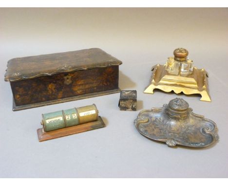A Victorian faux burr wood papier mâché writing slope, with brass mounts, two Victorian brass inkwells, a travel inkwell, ass