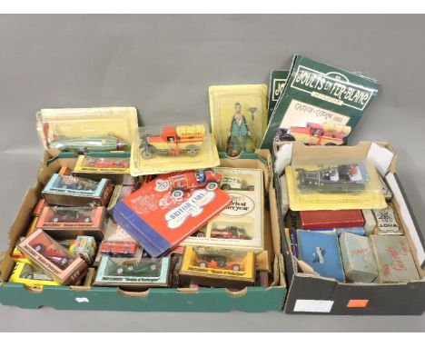 A collection of Matchbox toys, boxed, reproduction tin toys, vintage board games, and playing cards