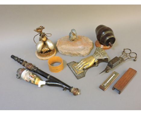 A mother of pearl desk bell, a thread barrel, candle snuffers, a letter clip, and a kingfisher