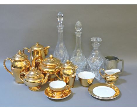 Gold Royal Worcester tea wares, and three cut glass decanters